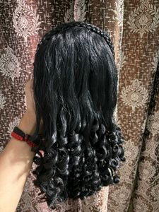 BLACK CURLY WIG WITH BRAID ACCENT