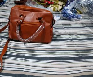 Stylish Tan Leather Handbag with Tassel Detail