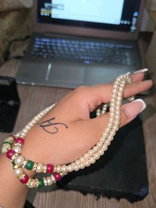 Red, green and white pearl necklace