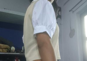 Cream Vest with White Puff Sleeves and black jeans