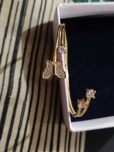 Combo of Silver Jhumka and Gold Bracelet