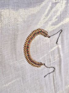 Elegant Gold Tone Necklace with Red & Green Stones