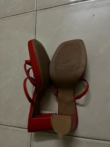 Unused red heels