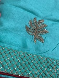 Elegant Teal Saree with Gold Embroidery