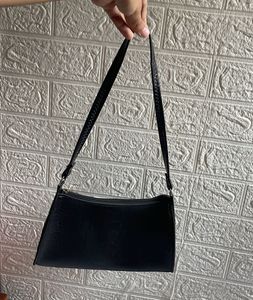 trendy sling black with portable space