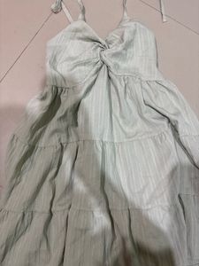 Safe green tiered babydoll mini dress