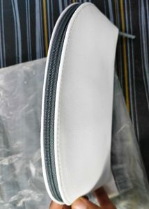 Lamcome White Pouch.