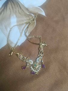 Elegant Gold Toned Necklace with Stones