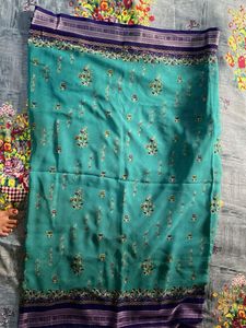 Teal Saree with Floral Motifs