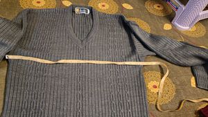 Gray V-Neck Knit Sweater and curtain