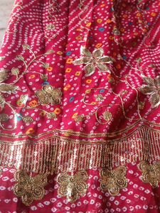 Stunning Bandhani Saree with Intricate Embellishme