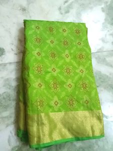 Vibrant Green Saree with Golden Border