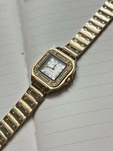 Elegant Gold Watch with Crystals