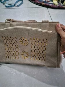 Elegant Grey Handbag with Gold Accents