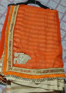 Elegant Orange Saree with Embellished Border