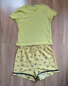 Only brand top with cute yellow shorts.