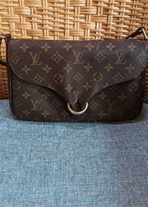 LV sling bag in mint condition, without code.
