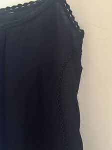 MNG- Black sleeveless top with fringe hem.-