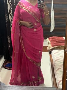 Elegant Pink Saree with Golden Detailing