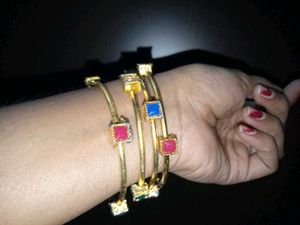 set of 2 Gold Toned Bangles with Gemstones