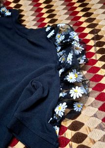 Chic Black Top with Floral Puff Sleeves