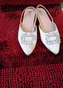 17. Elegant White Slingback Heels