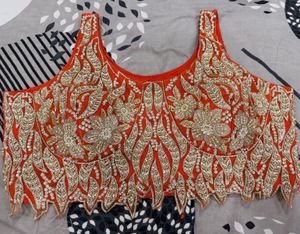 Stunning Orange Embroidered Lehenga Choli