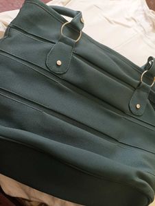 Chic Teal Handbag with Matching Pouch