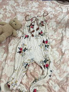 off white jumpsuit with floral touch