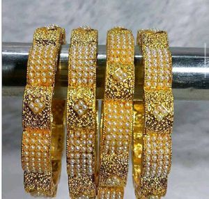 Elegant Gold Pearl Bangle Set