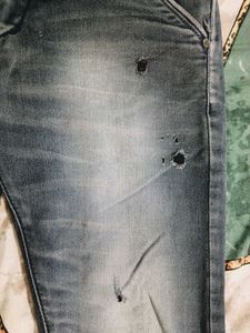 Distressed Blue Denim Jeans