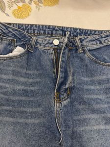 Distressed Blue Denim Jeans