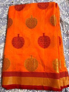 Vibrant Orange Saree with Leaf Motifs