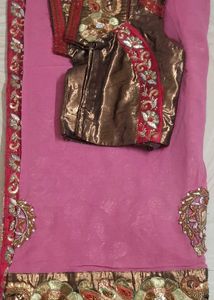 Elegant Pink Saree with Intricate Embellishments