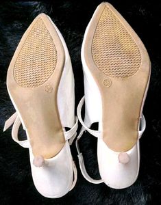 White Pointed Slingback Heels.