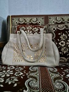 Elegant Grey Handbag with Gold Accents