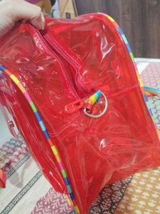 Red Jelly Duffle Bag with Rainbow Strap