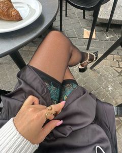 Sheer Thigh-High Stockings with Green Lace Trim