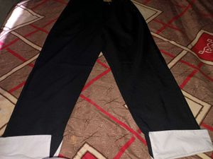 Black wide leg trousers with white cuffs