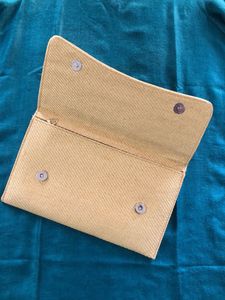 Embellished Peacock 🦚 clutch in jute finish..