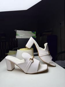 Chic White Block Heels with Gold Buckle