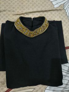 Elegant Black Dress with Embellished Neckline