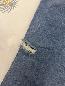 Distressed Blue Denim Jeans