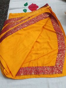 Vibrant Yellow Saree with Red Border