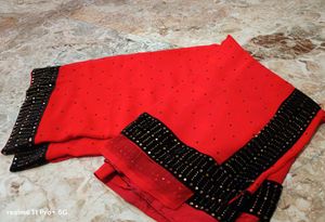 Elegant Red Saree with Black Embellished Border