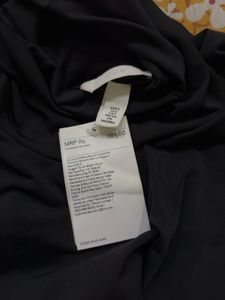Sleek Black Turtleneck Sleeveless Bodysuit