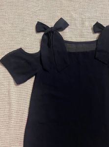 Chic Black Cold Shoulder Top with Bow Accents