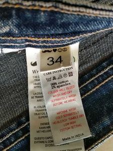Distressed Blue Denim Jeans