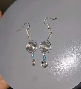 Silver Swirl Earrings with Blue Beads