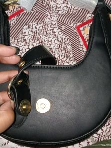 Chic Black Hobo Bag with Gold Accent